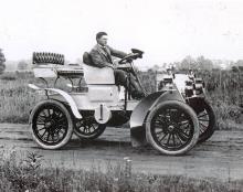 Mr Packard in early model Packard car